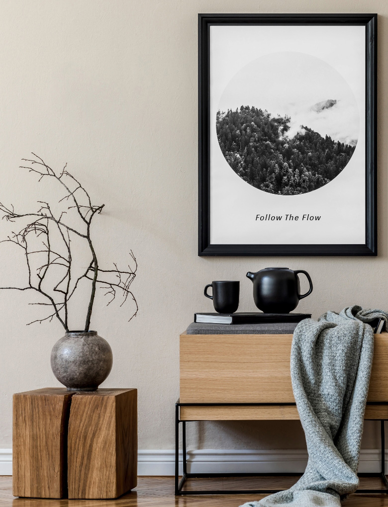 Modern Scandinavian living room interior styled with black mock up poster frame, side table, teapot, vase and throw rug.